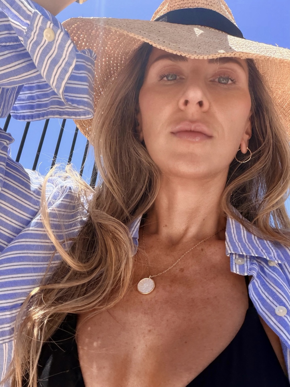 Close portrait of Crystal in a sun hat